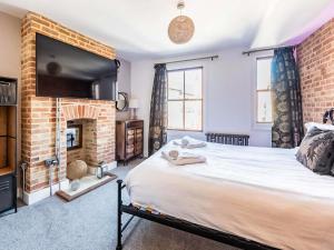 En eller flere senge i et værelse på Villa Otto