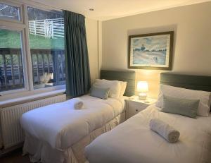 En eller flere senge i et værelse på Terrace by the Tide