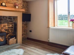 Μια τηλεόραση ή/και κέντρο ψυχαγωγίας στο Cosy Cottage