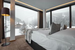 Voodi või voodid majutusasutuse Grand Hotel Hradec toas +113 fotot