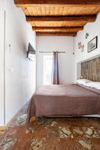 Postel nebo postele na pokoji v ubytování La Finestra su Noto