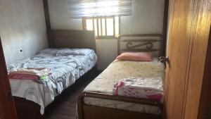Postel nebo postele na pokoji v ubytování Cabaña descanso + 3 fotografie