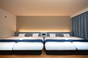 Ένα ή περισσότερα κρεβάτια σε δωμάτιο στο BRIDGE STAY BIWAKO PREMIUM- Luxury Villa , Hotel Quality Stay with Private Sauna, Jacuzzi & BBQ Terrace