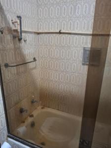 a bathroom with a bath tub in a room at Oasis do Leme in Rio de Janeiro +9 photos