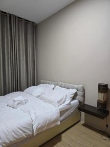 Voodi või voodid majutusasutuse Manhathan Suites toas +53 fotot