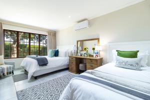 Ένα ή περισσότερα κρεβάτια σε δωμάτιο στο Mon Rêve Estate