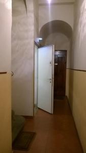 an empty hallway with a white door and a room at Rita Room in Florence