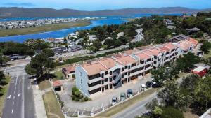 an aerial view of a building next to a river at A Whale of a Time Knysna in Knysna