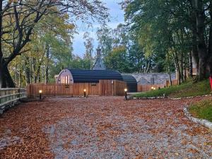 a house with a fence and a gravel driveway at Gallowhill Kirkside - Uk46515 in Newmill
