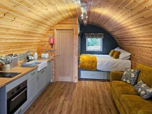 a kitchen and a bedroom in a tiny house at Gallowhill Kirkside - Uk46515 in Newmill +3 photos
