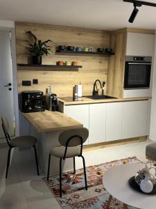 Η κουζίνα ή μικρή κουζίνα στο Apartment Donna +3 φωτογραφίες