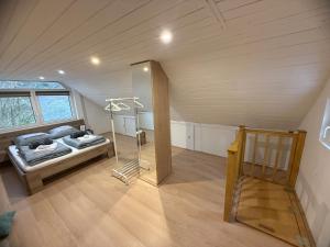 a room with a bed in a attic at Offline vendégház in Orfű