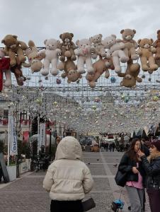 a bunch of teddy bears hanging from a ceiling at Luxury stay in Craiova in Craiova +1 photo