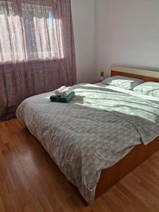 a bedroom with a bed with a blue bag on it at Luxury stay in Craiova in Craiova