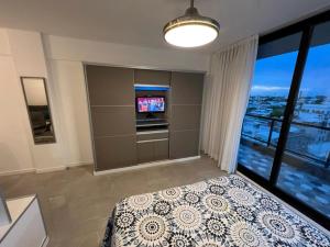 Ένα ή περισσότερα κρεβάτια σε δωμάτιο στο Dzain 1 - PISCINA -Gym- Cochera - Parrilla- Playromm- cercania Garrahan, favaloro, Britanico +36 φωτογραφίες