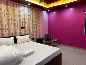 Ένα ή περισσότερα κρεβάτια σε δωμάτιο στο Hotel O Buddham Guest House