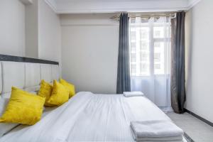 Postel nebo postele na pokoji v ubytování Kindaruma Homes Apartments