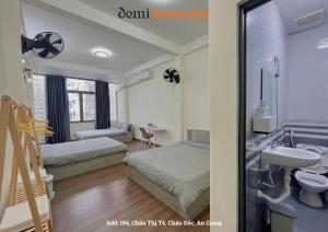 Giường trong phòng chung tại DeMi Homestay 2 - Châu Đốc