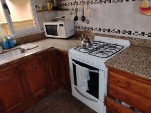 Kuchyň nebo kuchyňský kout v ubytování Rucalaf + 6 fotografií