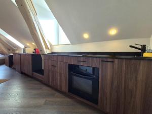 Kuchyň nebo kuchyňský kout v ubytování Romains - Bel appartement à Reims + 4 fotografie