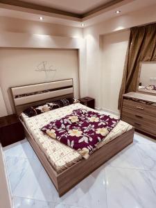 a bedroom with a large bed in a room at Apartments in Ain Sokhna in Porto in Ain Sokhna +71 photos