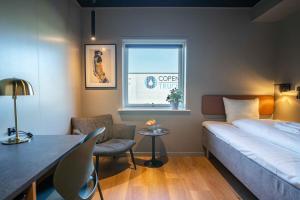 Una cama o camas en una habitación de MyHotel Taastrup