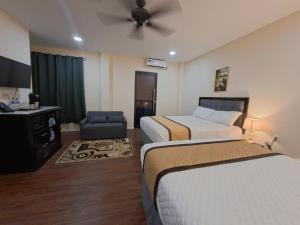 Ένα ή περισσότερα κρεβάτια σε δωμάτιο στο Rey'z Hotel and Suites +15 φωτογραφίες