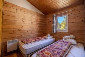 Ένα ή περισσότερα κρεβάτια σε δωμάτιο στο Chalet Montana 4 pers