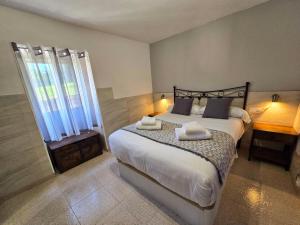 En eller flere senge i et værelse på Welcome A Casa de Pepe eLola