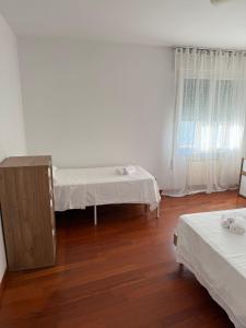 Giường trong phòng chung tại Appartamento Lido loft