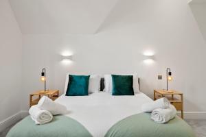 Voodi või voodid majutusasutuse Spacious 3bd l Family Home toas