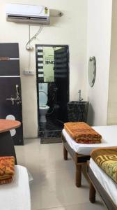 a room with a bathroom with a toilet and a sink at Hotal Satyam Shree in Jāmb