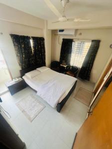 Postel nebo postele na pokoji v ubytování Gulshan Guest House