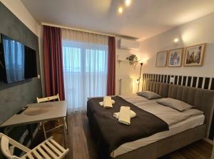 Ένα ή περισσότερα κρεβάτια σε δωμάτιο στο Royal Smart Apartments Cracow