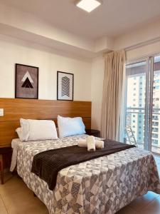 a bedroom with a bed and a large window at Madrid 1101 in Sao Jose do Rio Preto +22 photos