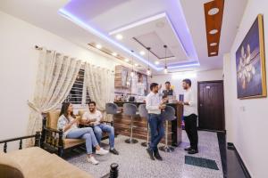 a group of people sitting in a room at FabHotel Eminent - Patel Nagar, 0riental University in Bhopal