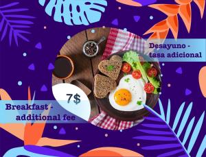 a plate of food with eggs and bread on a table at TROPICAL VACATION with nice view at PLAYA LOS CORALES in Punta Cana