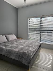 Ένα ή περισσότερα κρεβάτια σε δωμάτιο στο 2 Bedroom 2 Bathroom Executive Suite