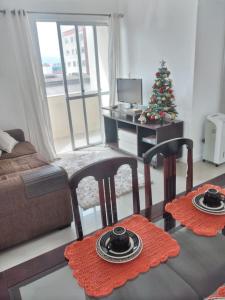 Un lugar para sentarse en Apartamento aconchegante a 15min do centro de Florianópolis