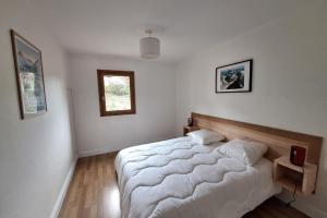 a bedroom with a large bed in a room at Modern apartment in the heart of Séez in Séez +10 photos