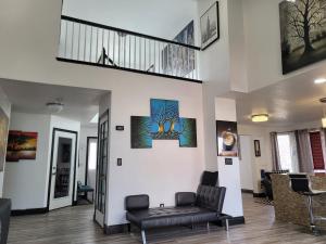 a living room with a couch and a staircase at Denver Layover B&B in DEN