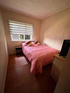 Voodi või voodid majutusasutuse Hostal refugio Licarayen toas