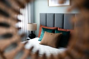 Ένα ή περισσότερα κρεβάτια σε δωμάτιο στο Przytulny apartament blisko molo Ostróda