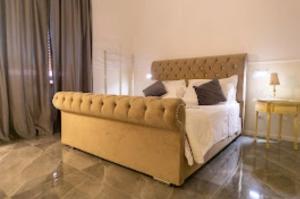a bedroom with a large bed in a room at PALAZZO NOVECENTO WELLNESS B&b in Lecco