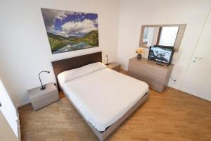 Giường trong phòng chung tại Borgo Murales