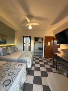 TV a/nebo společenská místnost v ubytování Hotel Ze Maria Cambui