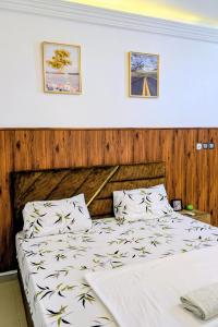 Ένα ή περισσότερα κρεβάτια σε δωμάτιο στο Archie Luxury