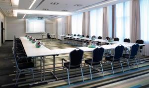 a conference room with a long table and chairs at Crowne Plaza Düsseldorf - Neuss by IHG in Neuss