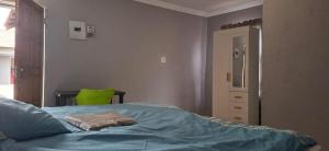 Ένα ή περισσότερα κρεβάτια σε δωμάτιο στο Magoveni Accommodation