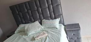 Ένα ή περισσότερα κρεβάτια σε δωμάτιο στο Magoveni Accommodation